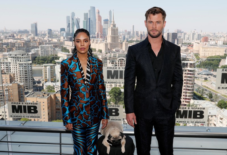 Chris Hemsworth and Tessa Thompson pose for a picture during a photocall for the film 