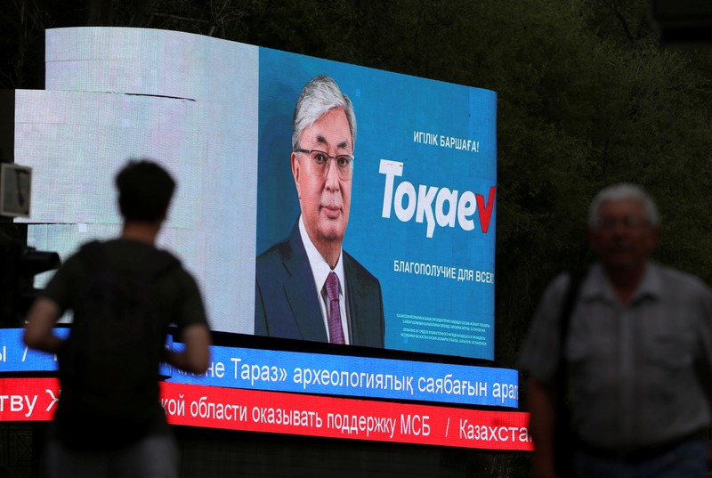 FILE PHOTO: A screen advertises the campaign of Kazakh President and candidate in the upcoming presidential election Tokayev in Almaty