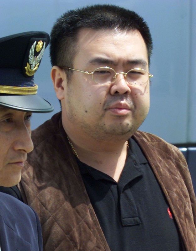 FILE PHOTO - KIM JONG NAM IS ESCORTED TO AN AIRPLANE