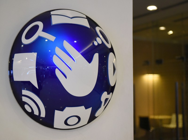 FILE PHOTO: A logo of Globe Telecom is seen at a Globe service center in Edsa, Quezon City, metro Manila