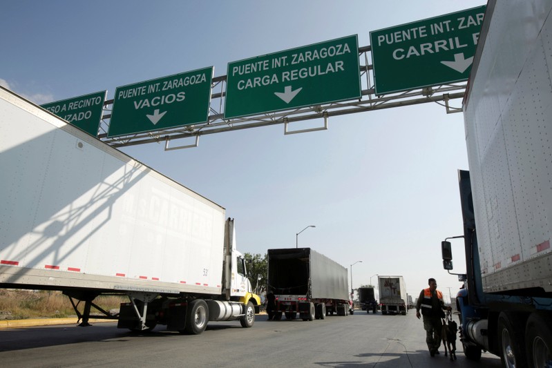 Trucks wait in a queue for border customs control to cross into the U.S., at the Zaragoza-Ysleta border crossing bridge in Ciudad Juarez