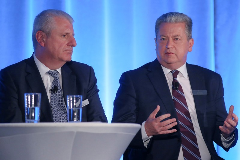 SNC-Lavalin Chief Operating Officer Ian Edwards and SNC-Lavalin President and Chief Executive Officer Neil Bruce speak during the company's annual shareholder's meeting in Montreal