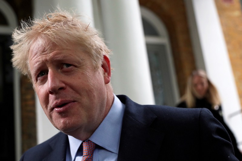 FILE PHOTO: PM hopeful Boris Johnson leaves his home in London