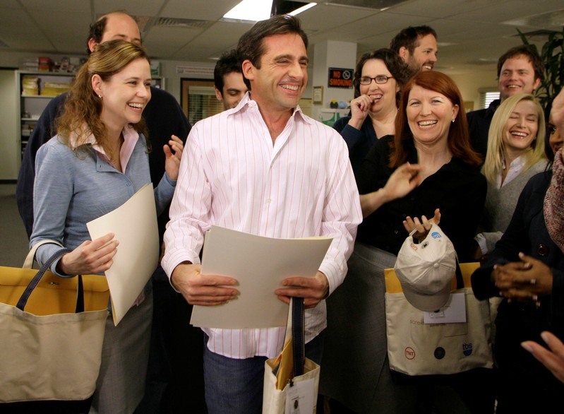 FILE PHOTO: Actor Steve Carell laughs along with other members of 
