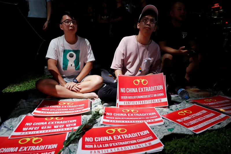 Demonstrators protest to demand authorities scrap a proposed extradition bill with China, in Hong Kong