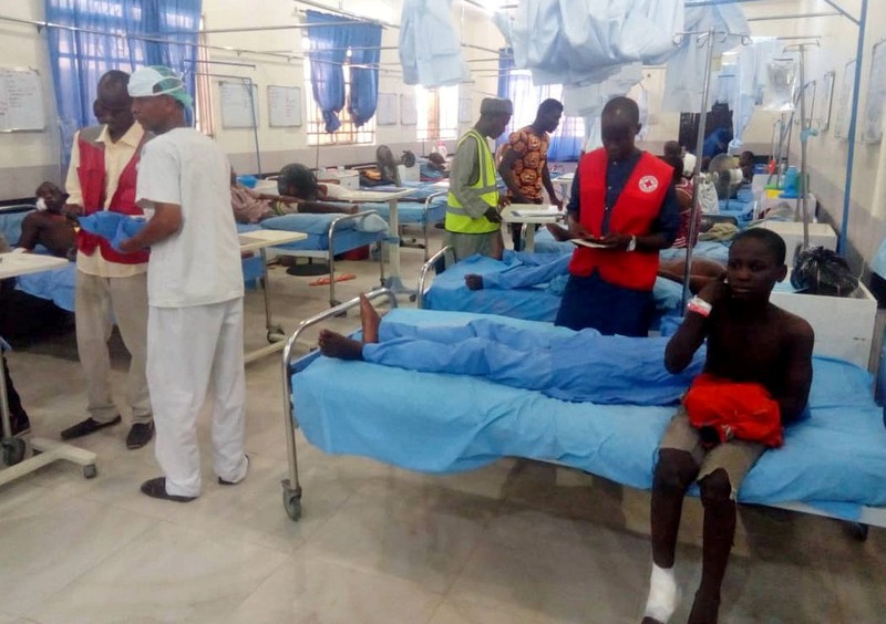 Injured people receive treatment inside a hospital in Maiduguri, after a triple suicide attack in northeast Nigerian state of Borno