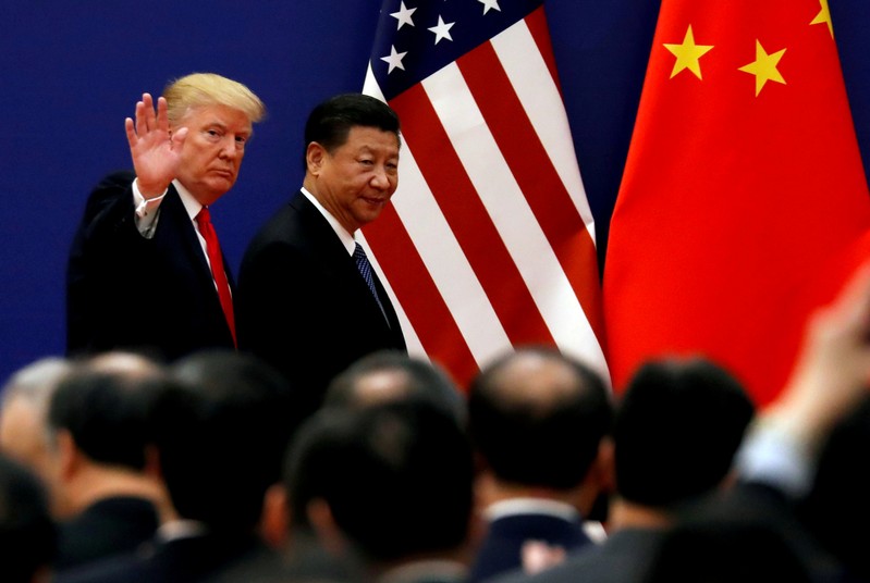 FILE PHOTO: FILE PHOTO: FILE PHOTO: U.S. President Donald Trump and China's President Xi Jinping meet business leaders at the Great Hall of the People in Beijing