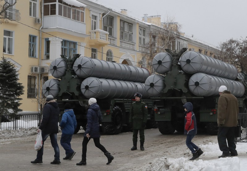 FILE PHOTO: People walk past Russian S-400 missile air defence systems before the military parade to commemorate the 75th anniversary of the battle of Stalingrad in World War Two, in Volgograd