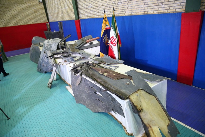 The purported wreckage of the American drone is seen displayed by the Islamic Revolution Guards Corps (IRGC) in Tehran