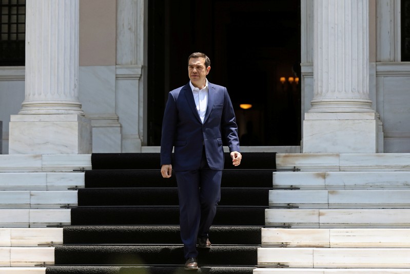 Greek Prime Minister Alexis Tsipras exits the Maximos Mansion to make a media statement in Athens