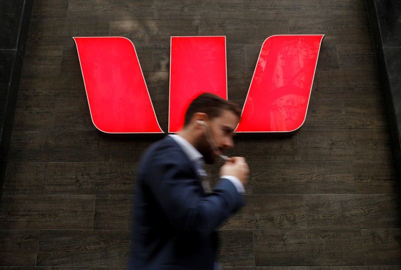 FILE PHOTO: A man walks past a Westpac bank branch in Sydney, Australia