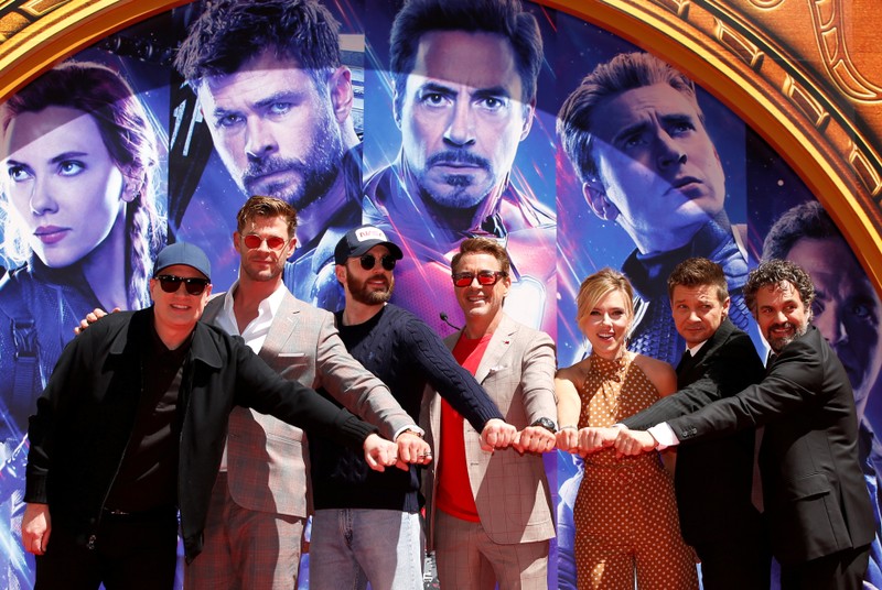 Actors Robert Downey Jr., Chris Evans, Mark Ruffalo, Chris Hemsworth, Scarlett Johansson, Jeremy Renner and Marvel Studios President Kevin Feige place their handprints in cement at a ceremony at the TCL Chinese Theatre in Hollywood
