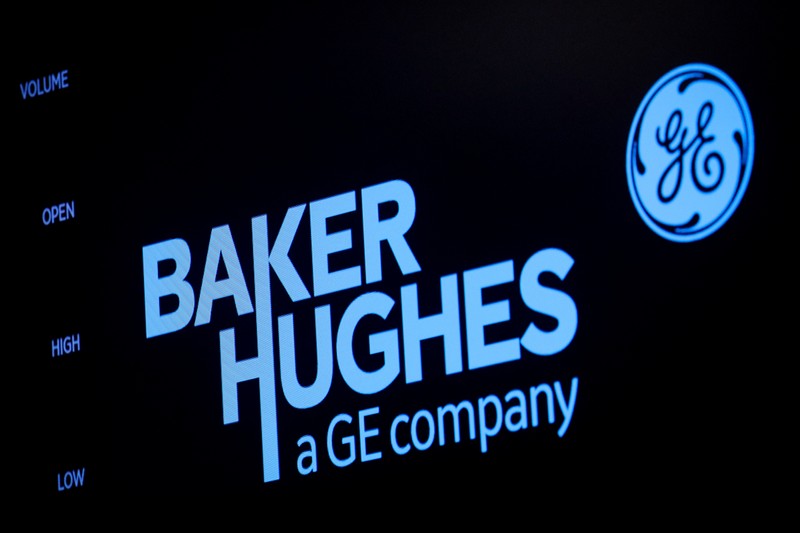 A screen displays the logo for Baker Hughes on the floor at the NYSE in New York