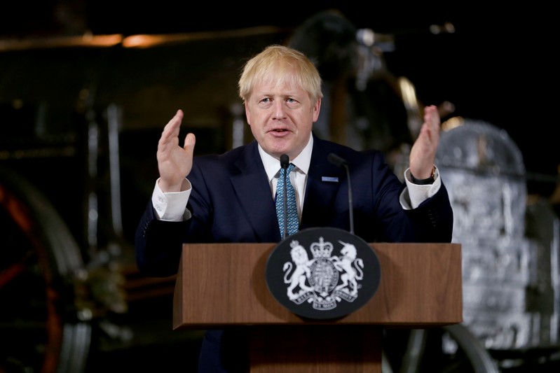 Britain's Prime Minister Boris Johnson gestures during a speech on domestic priorities at the Science and Industry Museum in Manchester