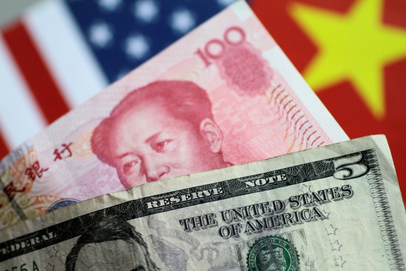 Illustration photo of U.S. Dollar and China Yuan notes
