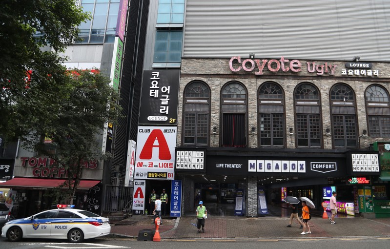 Police secure the area outside a night club after its upper floor collapsed in Gwangju