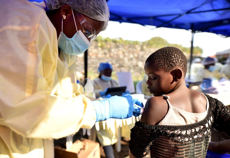 FILE PHOTO: A Congolese health worker administers Ebola vaccine to a child at the Himbi Health Centre in Goma