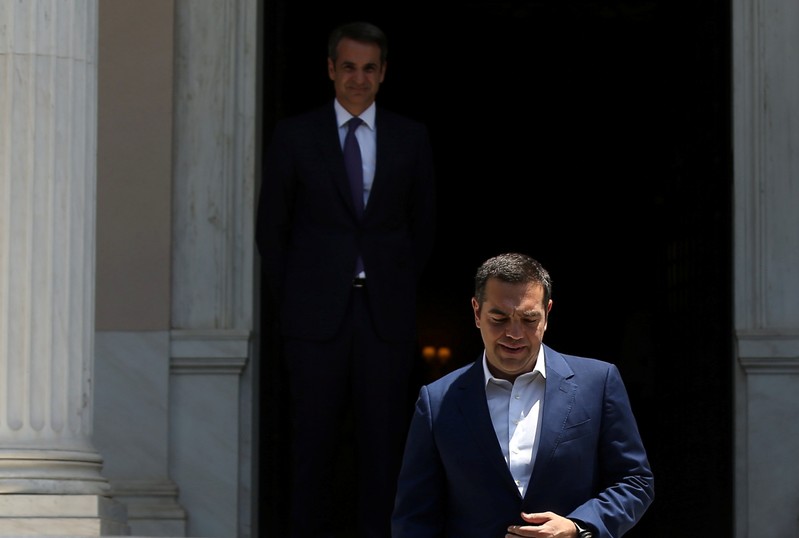 Newly-appointed Greek Prime Minister Mitsotakis meets with outgoing Prime Minister Tsipras in Athens