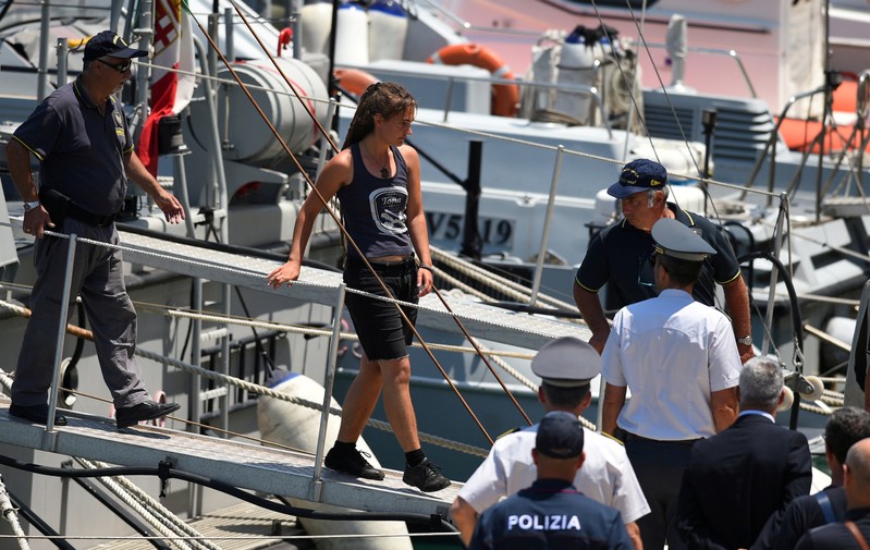 FILE PHOTO: Carola Rackete, the 31-year-old Sea-Watch 3 captain, disembarks from a finance police boat, in Porto Empedocle