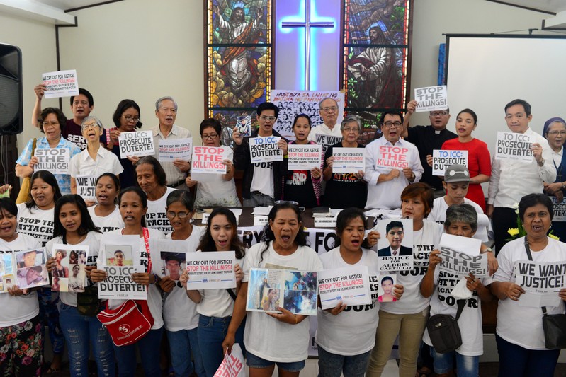 Activists and families of drug war victims display placards during a protest against the war on drugs by President Rodrigo Duterte in Quezon city