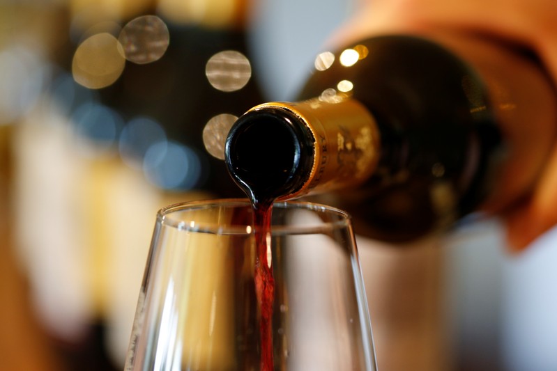 French red wine is poured into a glass at the Chateau du Pavillon in Sainte-Croix-Du-Mont,