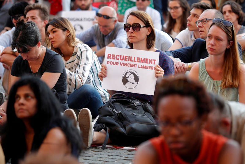 FILE PHOTO: People demonstrate in support of French quadriplegic Vincent Lambert in Paris