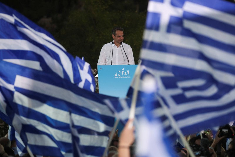 Main opposition New Democracy conservative party leader Mitsotakis waves to supporters during a pre-election rally in Athens