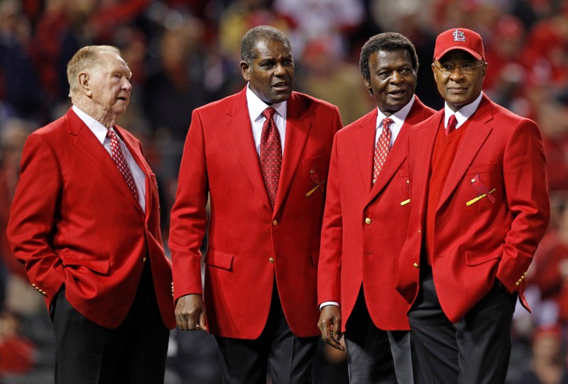 FILE PHOTO: Baseball Hall of Fame members and former St. Louis Cardinals (L-R) Schoendienst, Gibson, Brock and Smith appear on the field before the start of play between the St. Louis Cardinals and the Texas Rangers in Game 6 of MLB's World Series baseball