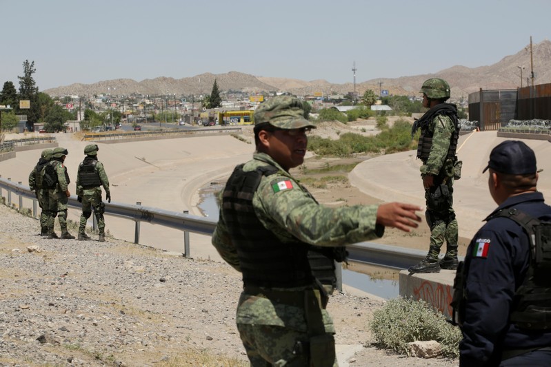 Mexican soldiers take part in an operation at the border to inhibit migrants to cross illegally into the United States, according to local media, in Ciudad Juarez