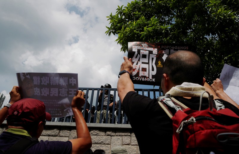 Demonstrators march to protest against the Yuen Long attacks in Yuen Long