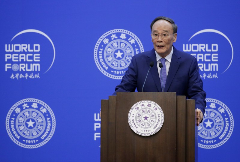 Chinese Vice President Wang Qishan delivers a speech at the opening of World Peace Forum in Beijing
