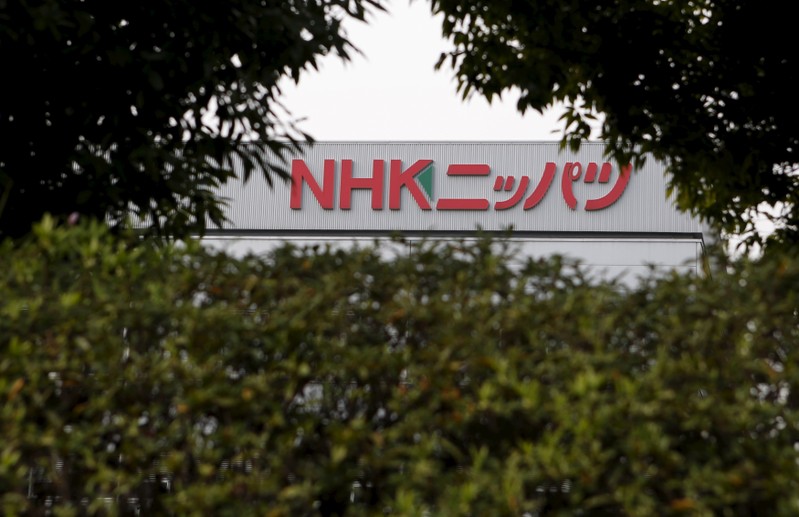 FILE PHOTO: A sign of NHK Spring Co, commonly known as Nippatsu, is seen through foliage at its factory in Ota