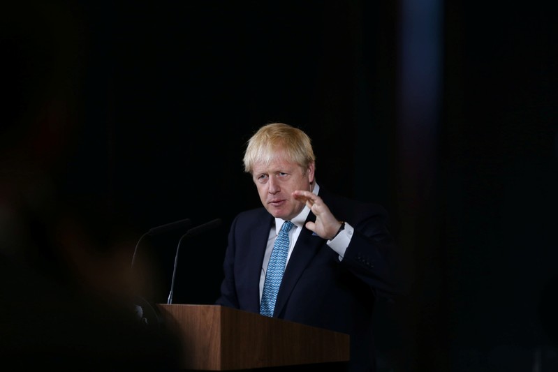 Britain's Prime Minister Boris Johnson gestures during a speech on domestic priorities at the Science and Industry Museum in Manchester