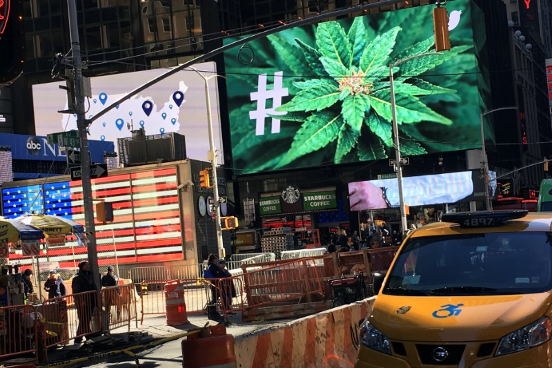 An electronic billboard displays a marijuana hashtag at Times Square in New York