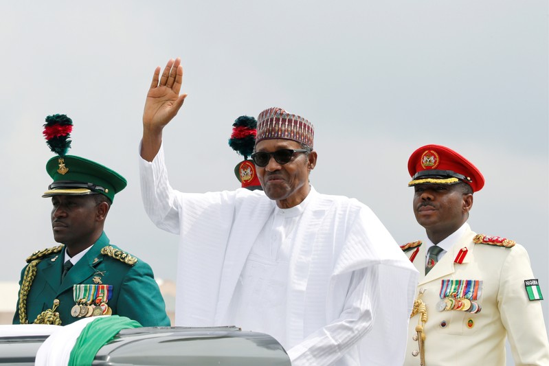 FILE PHOTO: Nigerian President Muhammadu Buhari waves at the crowd during a celebration ceremony marking Democracy Day in Abuja
