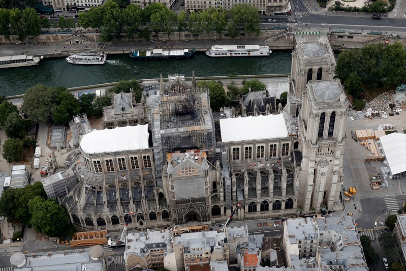 FILE PHOTO: A view shows the damaged roof of Notre-Dame de Paris during restoration work, three months after a fire that devastated the cathedral in Paris