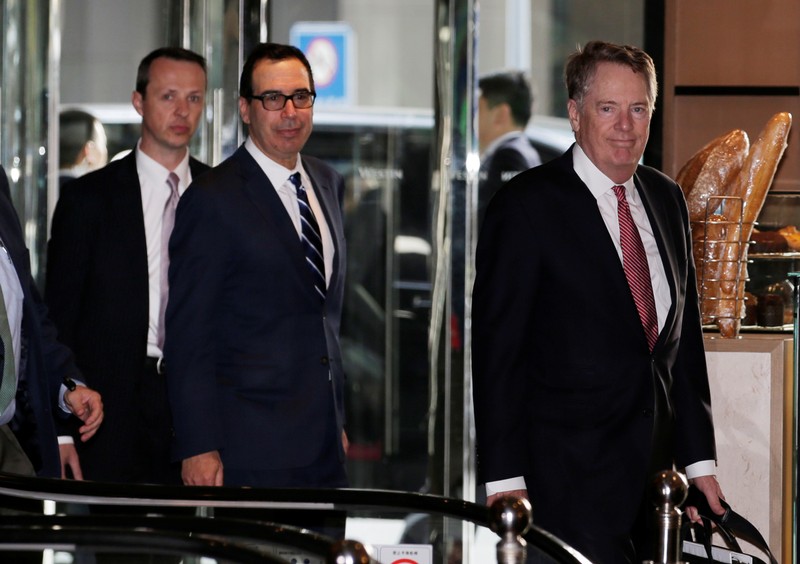 Members of the U.S. trade delegation Steven Mnuchin and Robert Lighthizer arrive at a hotel in Beijing