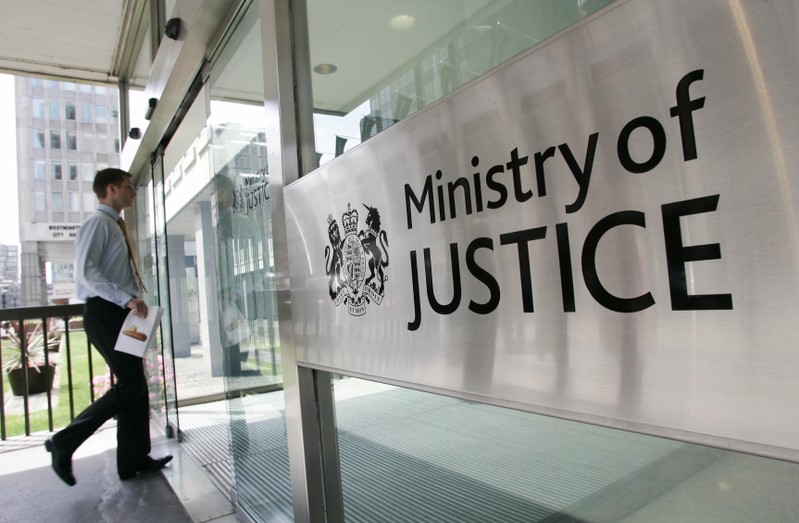 FILE PHOTO: A man enters The Ministry of Justice in London
