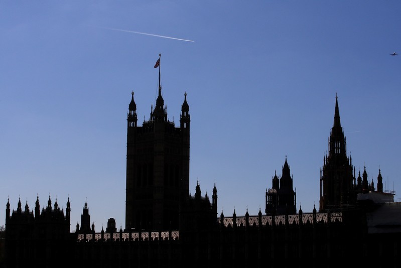 The Houses of Parliament are silhouetted in London