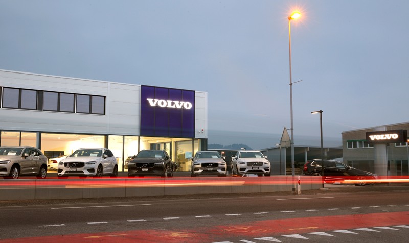 FILE PHOTO: A long exposure picture shows cars of Swedish automobile manufacturer Volvo displayed in front of a showroom of Stierli Automobile AG company in St. Erhard