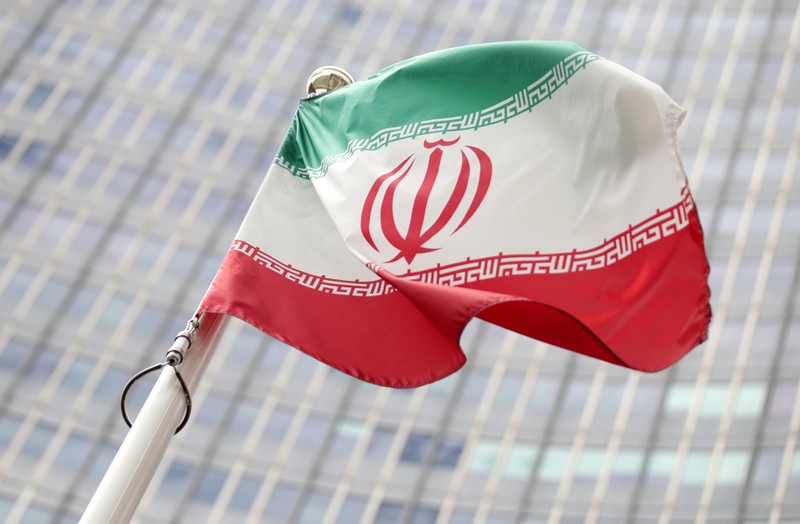 FILE PHOTO: The Iranian flag flutters in front the International Atomic Energy Agency headquarters in Vienna