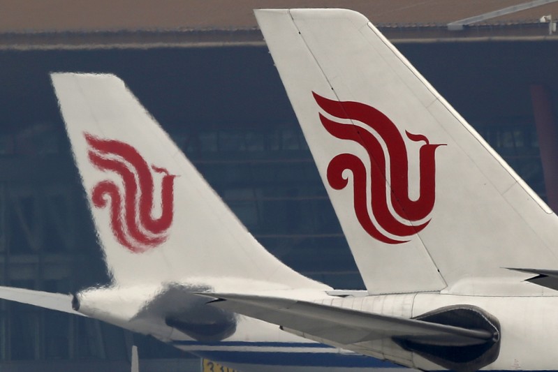 Flights of Air China are parked on the tarmac of Beijing Capital International Airport in Beijing