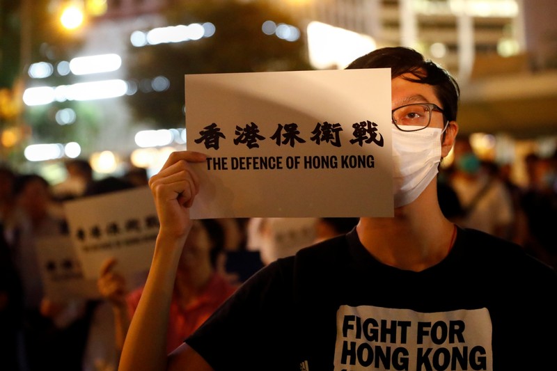 People attend a protest in Hong Kong