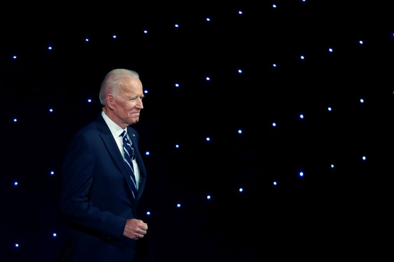 FILE PHOTO: Candidate former Vice President Joe Biden walks on stage before the start of the second night of the second 2020 Democratic U.S. presidential debate in Detroit