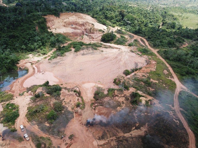 An aerial view shows machines being destroyed during an operation conducted by the Brazilian Institute for the Environment and Renewable Natural Resources (IBAMA) and Federal Police at an illegal gold mine near the city of Altamira