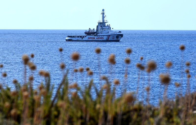 Spanish migrant rescue ship Open Arms lies anchored close to the Italian shore in Lampedusa