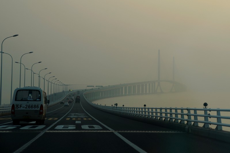 FILE PHOTO: A bridge covered in smog is seen during a polluted day in Shanghai
