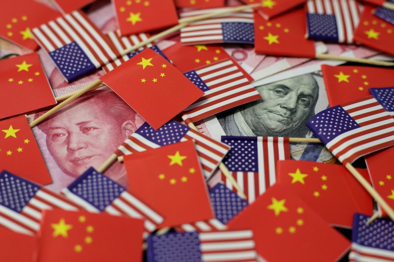 FILE PHOTO: Illustration picture showing U.S. dollar and China's yuan banknotes