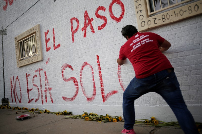 A man takes part in a rally against hate a day after a mass shooting at a Walmart store, in El Paso