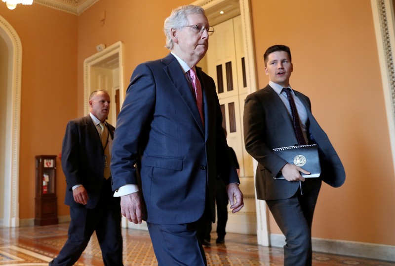 FILE PHOTO: Senate Majority Leader Mitch McConnell walks through the U.S. Capitol Building in Washington